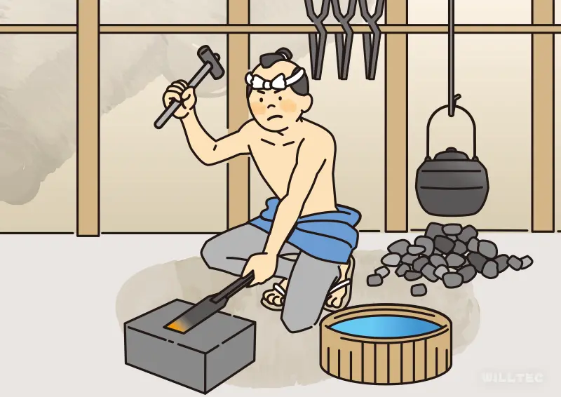 鉄を熱し鍛錬する鍛冶職人